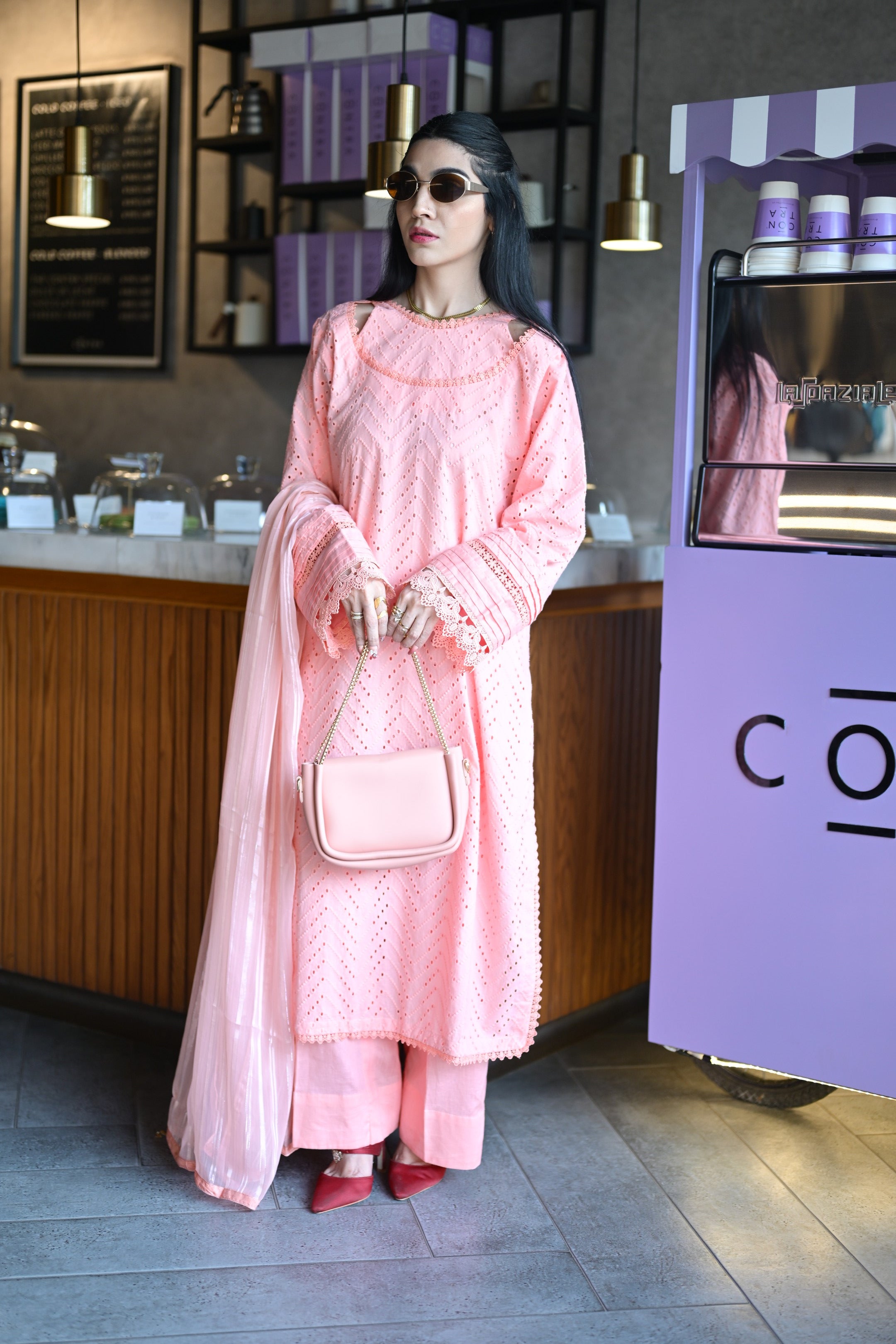 Full body shot of Gulaabi Dastaan styled with matching cotton trouser and satin dupatta.