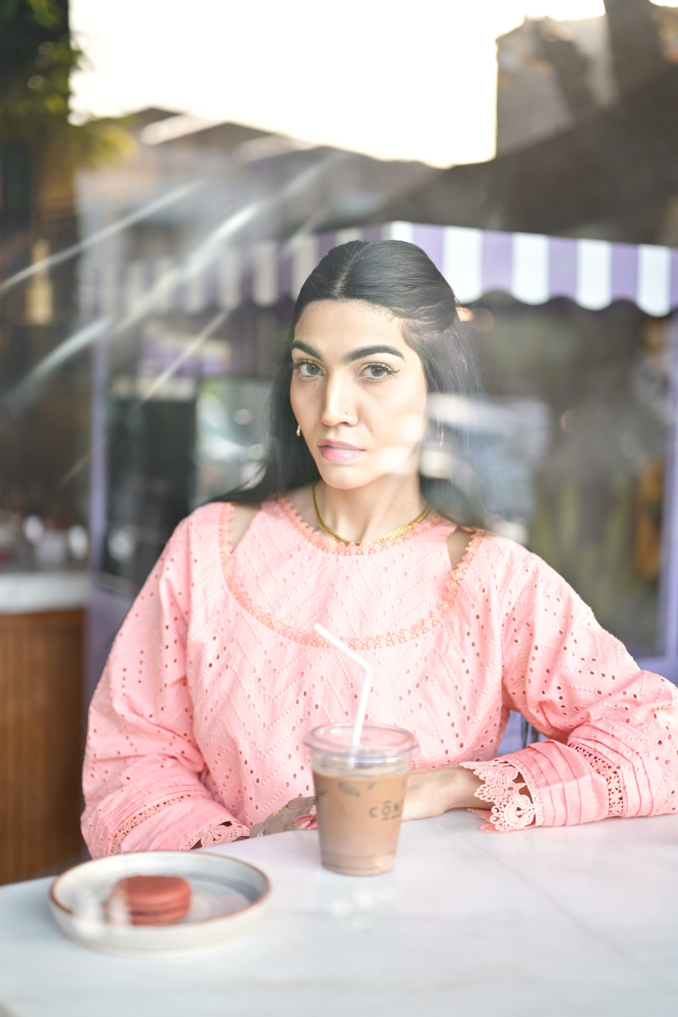 Model looking sideways wearing Gulaabi Dastaan — timeless pink festive elegance.