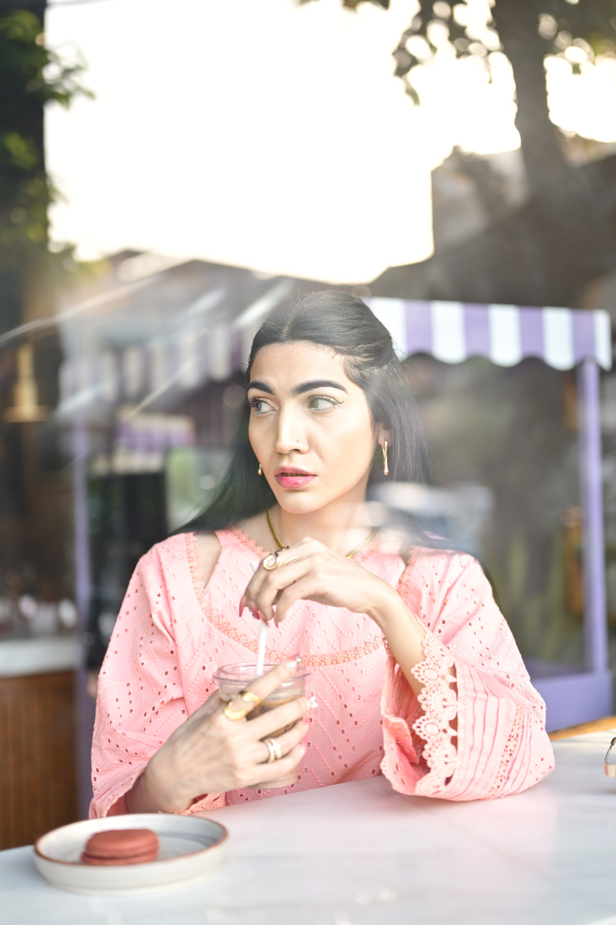 Seated side view of Gulaabi Dastaan highlighting flowy silhouette.