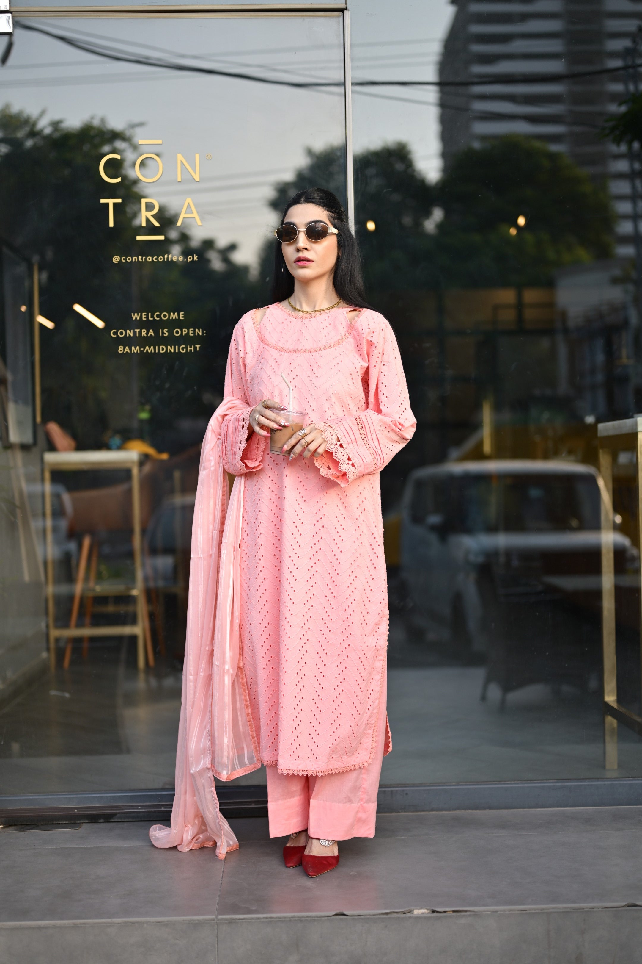 Over-the-shoulder shot highlighting dupatta drape and lace finishing.